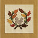 A decorative patch featuring a squirrel surrounded by colorful autumn leaves in a circular design.