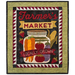 A decorative quilt featuring the text Farmer's Market at the top, a jar filled with colorful vegetables like carrots, tomatoes, and corn in the center, and a banner stating Locally Grown at the bottom. The background has a patterned border with triangles in red and white.