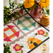 Table runner featuring geometric squares along with bee and floral appliqué on each end.