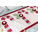 Red and white table runner featuring 3 candy canes with fabric yo-yos, all made of Winter themed fabric prints.