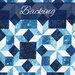 Tonal blue fabric with geometric design and small snowflakes labeled as backing.