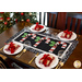 Black and white table runner featuring 3 candy canes with fabric yo-yos, all made of Winter themed fabric prints.