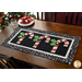 Black and white table runner featuring 3 candy canes with fabric yo-yos, all made of Winter themed fabric prints.