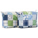 Two small bags with hanging charms and patchwork design made of blue, green, and white summer themed fabrics on a white background