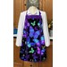Vibrant blue, purple, mint green, and black butterfly themed apron displayed on a mannequin.