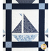 Quilt block of geometric sail boat made of white and blue floral fabrics.