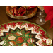 Folded star table topper with lovely Christmas prints in red, green, and white.