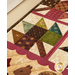 Pint Size Table Runner featuring leaf like geometric piecing and squirrel and leaf appliqué.