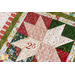 detail of quilted star block showing different kinds of fabric