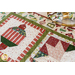 close up of table runner blocks showing a Christmas bauble and star block
