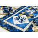 Christmas themed table runner featuring bell designs made of blue and cream snowflake fabrics.