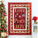 Christmas Joy Quilt Kit featuring the words Love, Peace, and Joy on red and gold fabric.