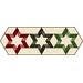 Hexagonal table runner featuring three layered star patterns in red, black, and green on a cream background.