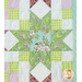 Close up of sawtooth star and checker design in pastel green and purple fabrics.