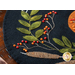 Wool placemat with appliqué of a horn filled with fruits and a pumpkin.