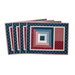 Placemats with log cabin rectangular strip design featuring a pocket for silverware and red, blue, and cream fabric prints.