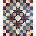 Quilt with Ohio stars in a diamond shape design made of red, white, and blue floral printed fabrics.