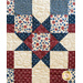 Close up of quilt block with an Ohio star and patchwork design.