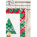 Small quilt with three pine trees in green, red, and white fabrics hanging from a star shaped craft holder.