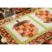 Table runner with acorn pieced blocks made with brown and cream floral fabric prints.