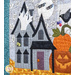 Quilt block featuring a dark halloween decorated house with jack-o-lanterns.