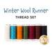 Image of a thread set for a Winter Wool Runner, featuring seven spools of thread in various colors, with text above that reads Winter Wool Runner and THREAD SET. A logo from Shabby Fabrics is shown at the bottom right.