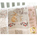 Close up photo of a cream, pink, and grey quilt that features rabbits from the children's book, 