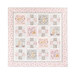 Photo of a cream, pink, and grey quilt that features rabbits from the children's book, 