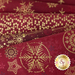 A collection of red fabric with gold patterns, featuring snowflakes, stars, and geometric shapes in various designs.