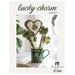 front cover of Lucky Charm Garden pattern with a photo of the completed project sticking out of a  green gnome mug