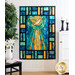 Image of a pieced quilt made of blue, yellow and aqua stained-glass looking fabric with a yellow dove and sunrays in the middle. The quilt is hanging on a wall, framed on the right by a cabinet with candles, and on the left by a tree and table with a vase on it