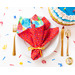 A red Party Time Cloth Napkin on a place setting.