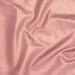 Overhead shot of twisted and draped fabric that showcases the sparkle, sheen, and texture of the fabric.