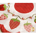 Close up of June table topper showing white and red fabric and floral embroidery detail with strawberry shaped applique