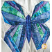 Close up photo of a blue and green butterfly made with foundation paper piecing techniques