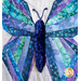 Close up photo of a blue and green butterfly made with foundation paper piecing techniques