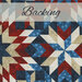 fabric with red, white, and blue geometric designs and a pale banner at the top that reads 