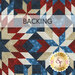 fabric with red, white, and blue geometric designs and a pale banner at the top that reads 
