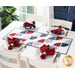 A white table in front of a blue wall with a bright window and green houseplant in the background with four place settings and a patriotic themed table runner with matching cloth napkins at each place setting.