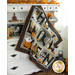 A colorful quilt with Halloween-themed designs, including pumpkins, ghosts, and bats, is draped over a white cabinet. In the background, there are autumn leaves and decorative elements, creating a cozy seasonal atmosphere.