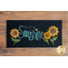 black rectangular table mat on a brown wooden countertop with the words 