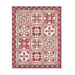 Photo of a large red and cream patchwork quilt isolated on a white background