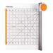 A Fiskars fabric cutter with a grid and measurement markings, featuring an orange rotary cutter handle.