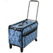 A blue patterned rolling luggage with a handle and wheels, designed for easily transporting sewing equipment.