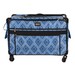 A blue patterned rolling suitcase with a diamond design and black trim, featuring front pockets.