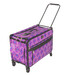 A purple, wheeled suitcase with a geometric pattern and retractable handle.