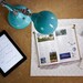 overhead view of turquoise LED lamp on a desk