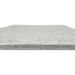 Gray felt mat viewed from the side, highlighting its thickness and texture.