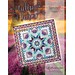 Colorful quilt design titled Tulip Farm over a backdrop of vibrant tulip fields and a sunset.