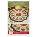 A Shabby Fabrics pattern featuring a table topper with a circular design with poinsettias, candy canes, and trees.